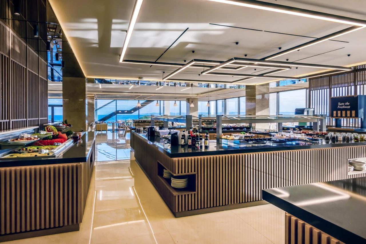 Ammoa Luxury Hotel & Spa Resort Nikiti  Exterior foto The buffet at the 101 lounge