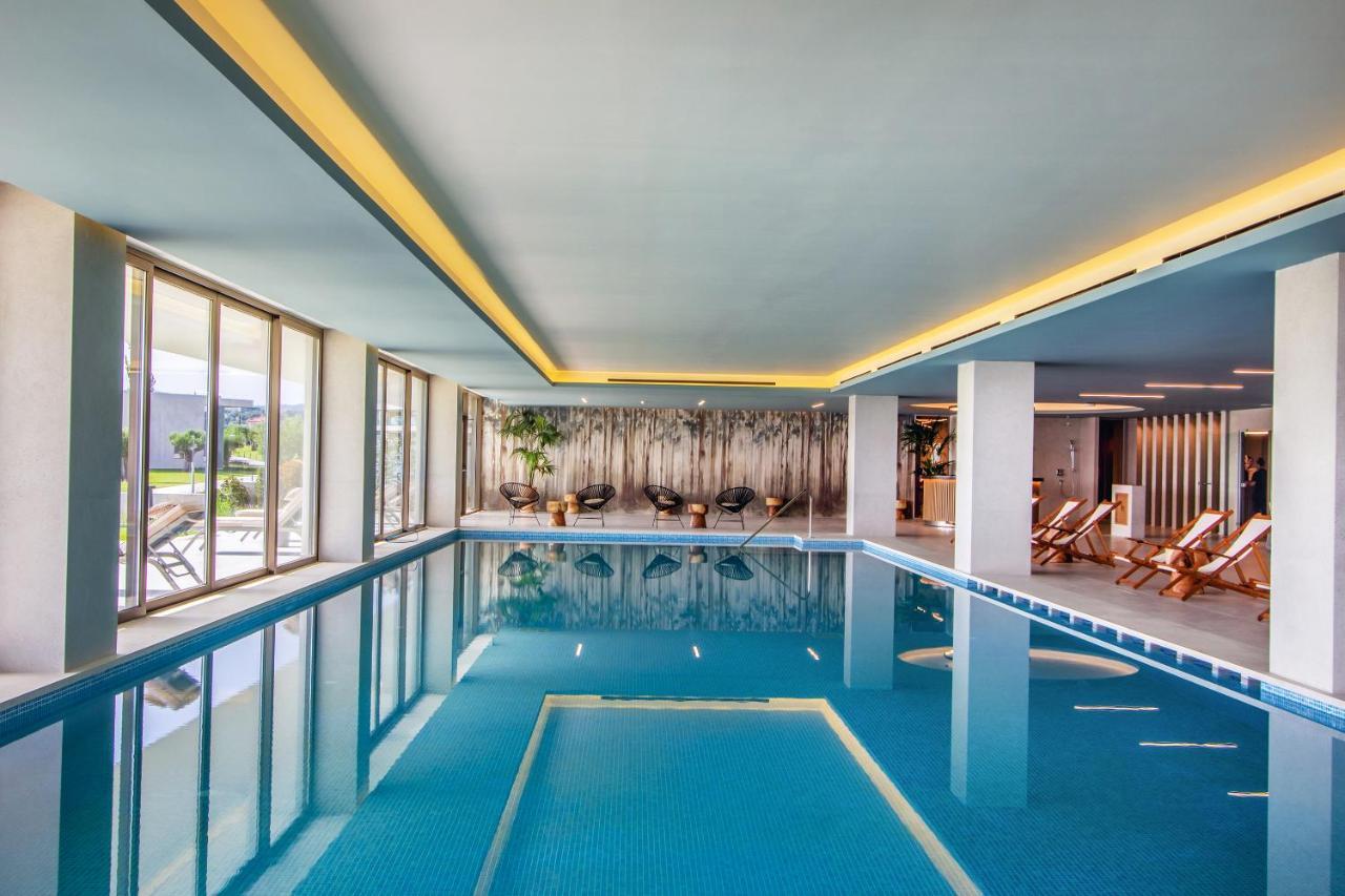 Ammoa Luxury Hotel & Spa Resort Nikiti  Exterior foto The swimming pool at the hotel